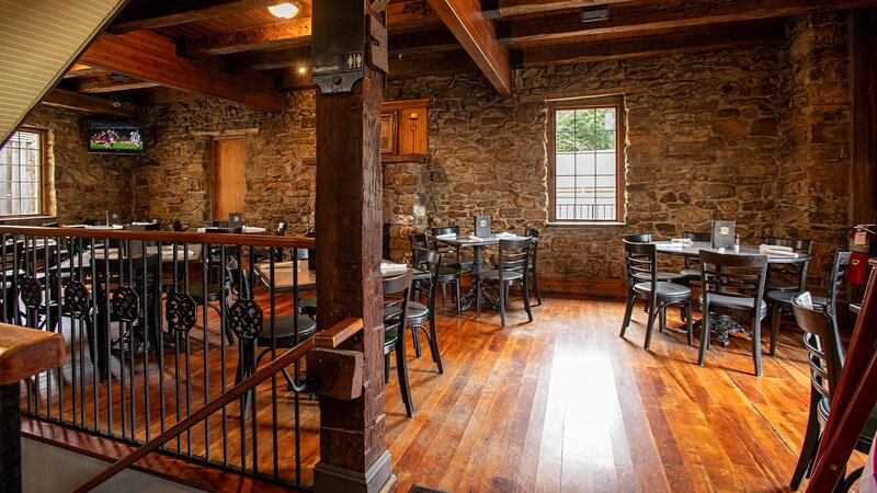 Upstairs dining room with many set tables